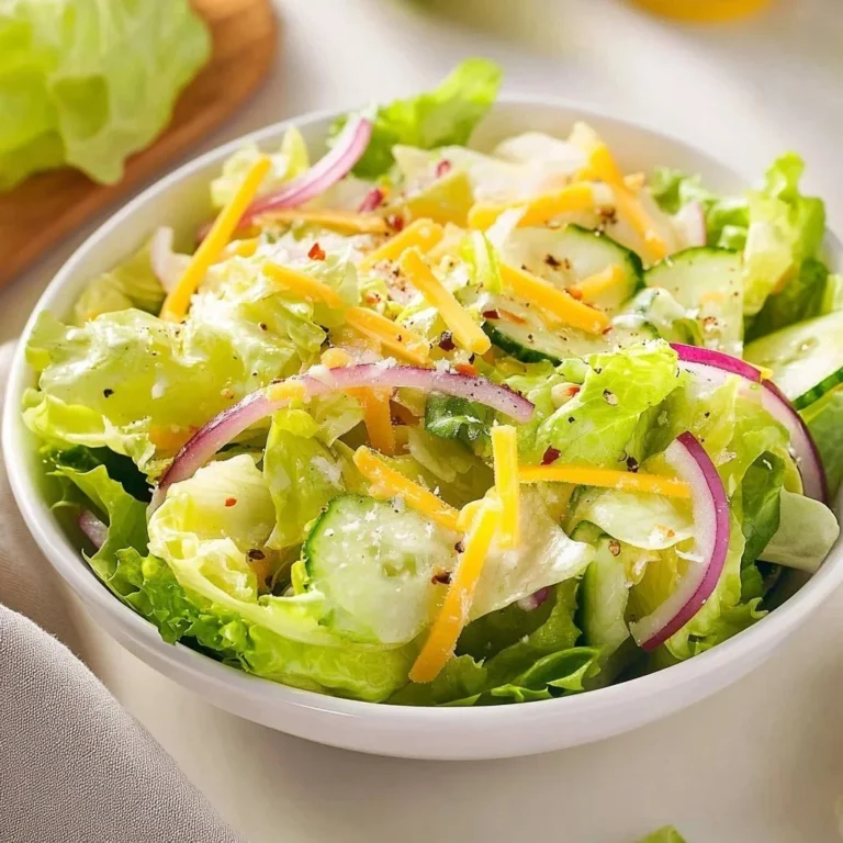 A vibrant Citrus Parmesan Salad with mixed greens, citrus segments, and shaved Parmesan cheese.