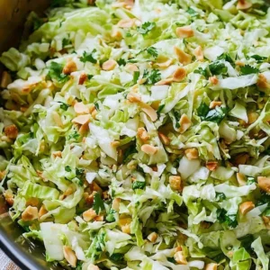 Spicy sesame ramen noodle salad with fresh vegetables and vibrant flavors